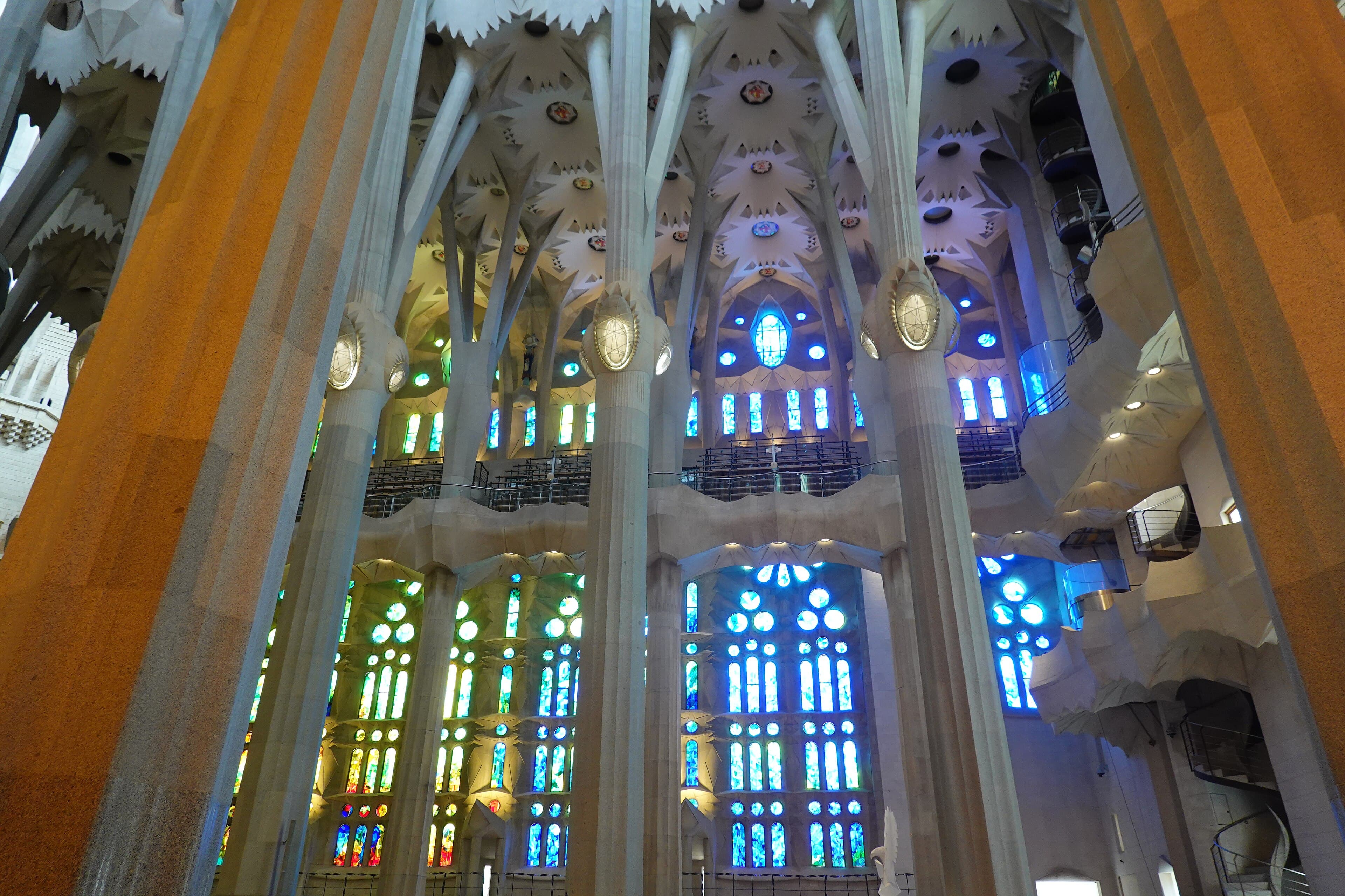The stained-glass nave of the Sagrada Família — Gaudí’s forest of columns filled with colour.