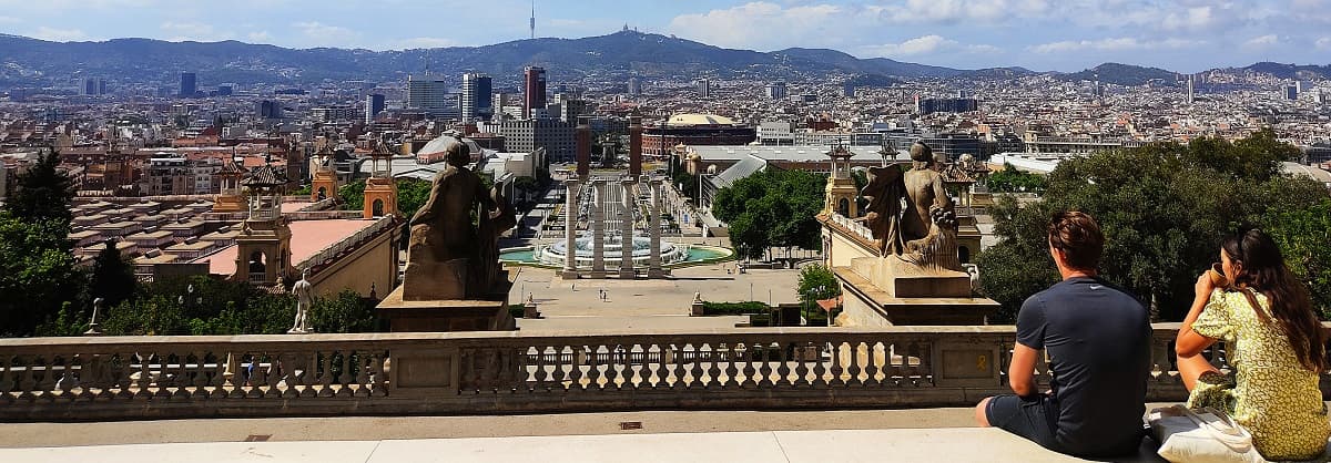 A wide panoramic view over Barcelona’s rooftops from an elevated terrace