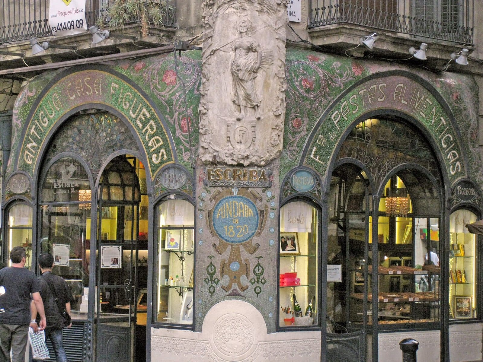 The colourful modernista mosaic and stained-glass shopfront of the Antiga Casa Figueras on La Rambla