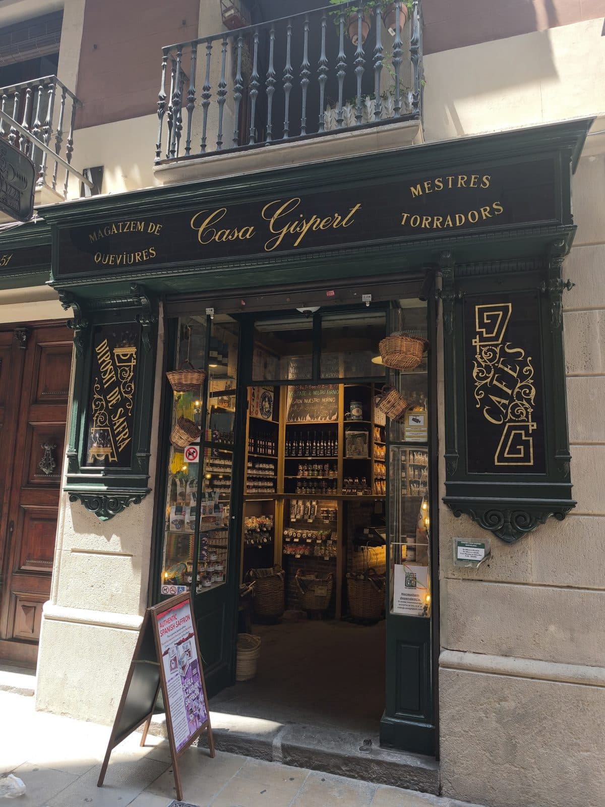 The green wooden shopfront of Casa Gispert, “Mestres Torradors”