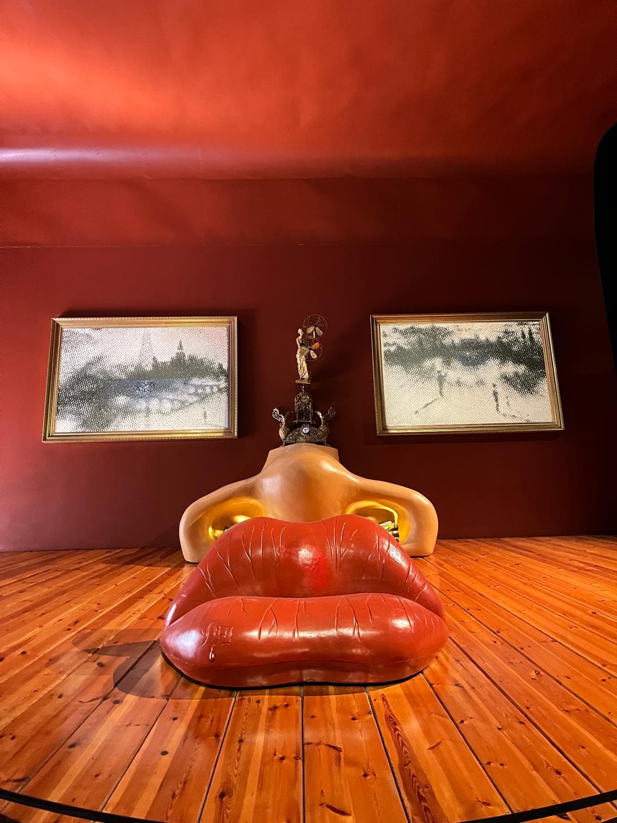 The Mae West Room inside the Dalí Theatre-Museum in Figueres, with the red lips sofa and face-shaped installation