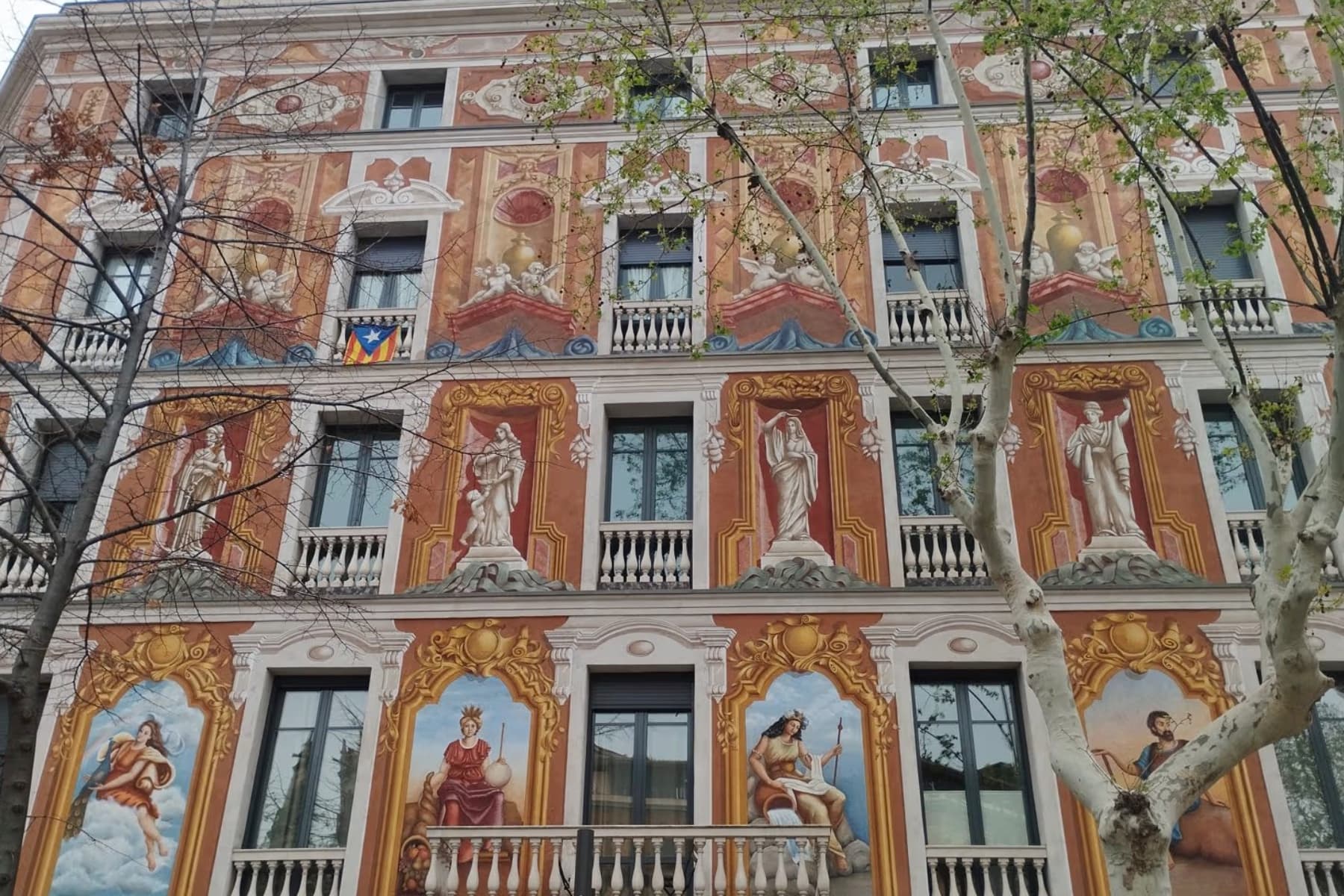 A richly painted Modernist residential façade in Barcelona’s Eixample