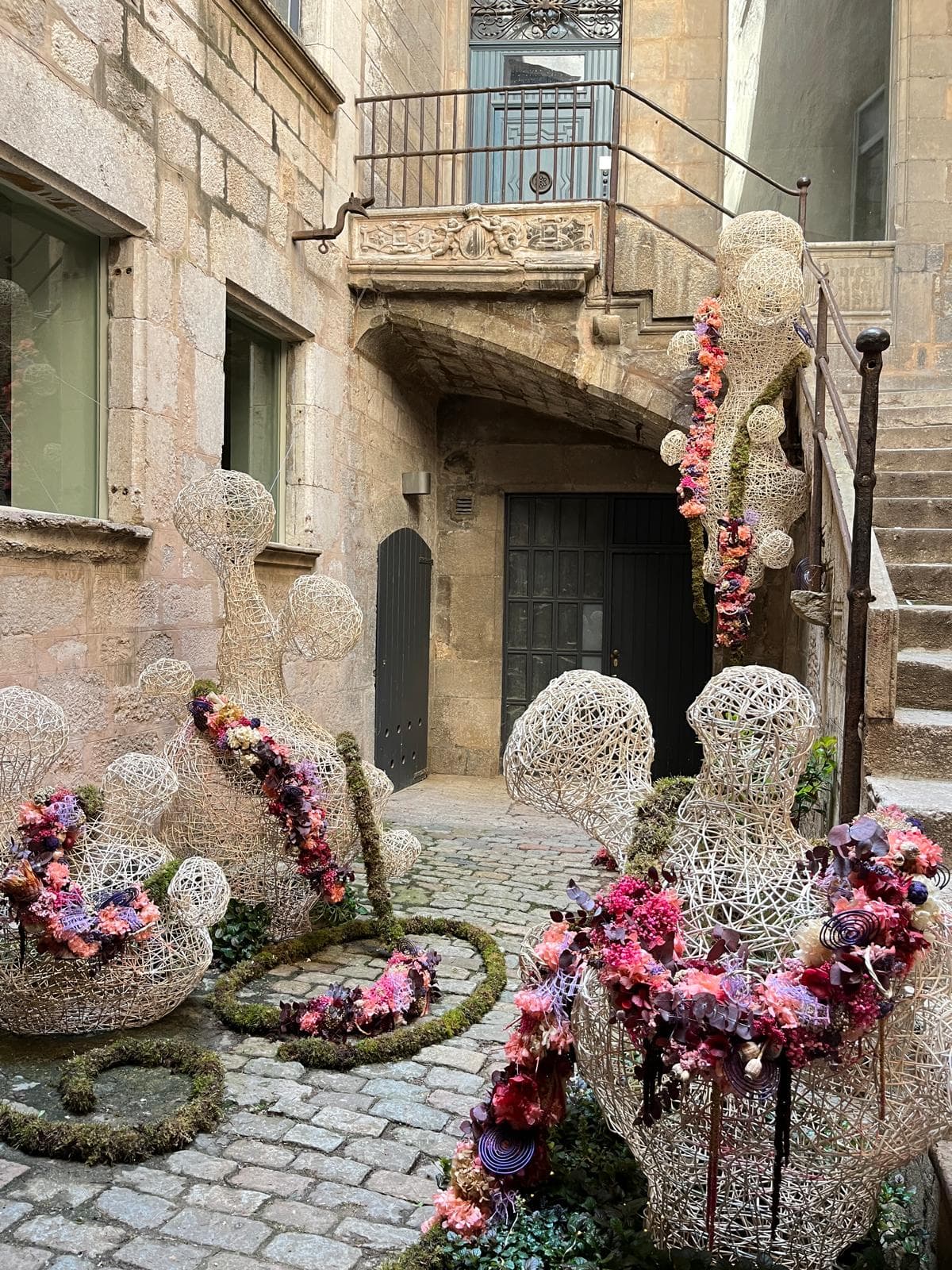 A Girona old-town lane decorated with flowers during the Temps de Flors festival