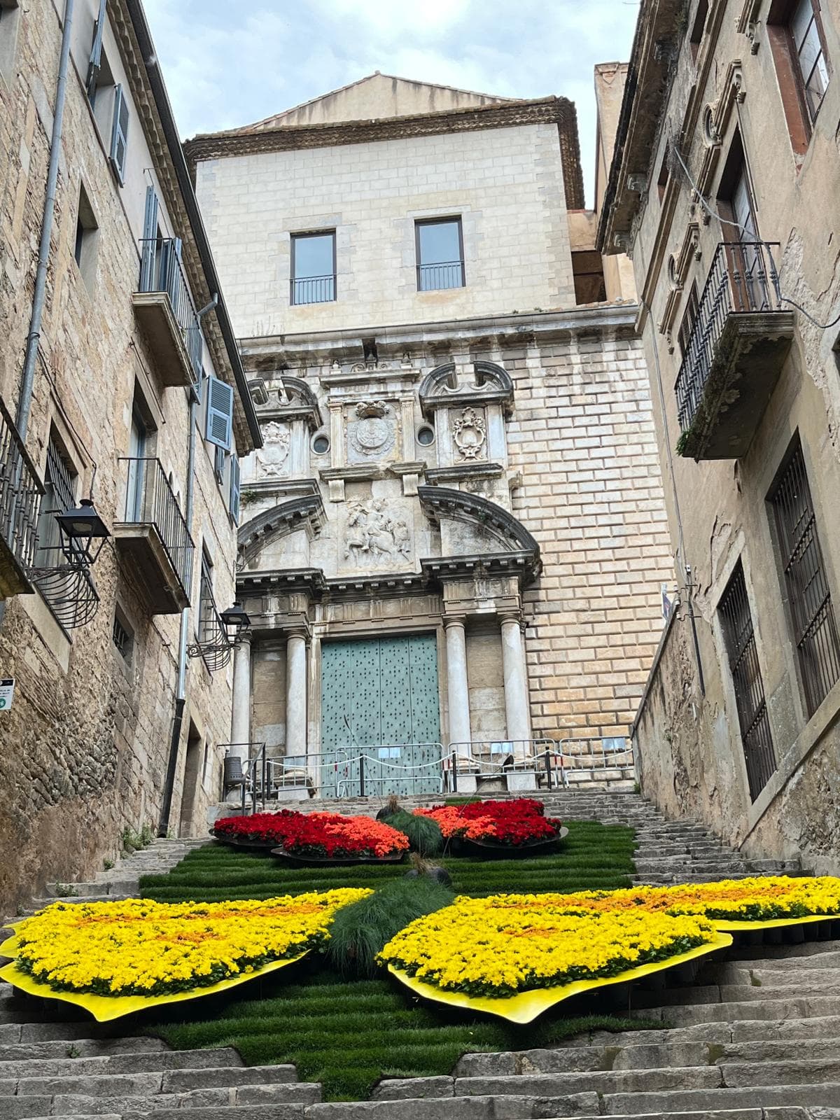 A carpet of flowers laid across a Girona square during Temps de Flors