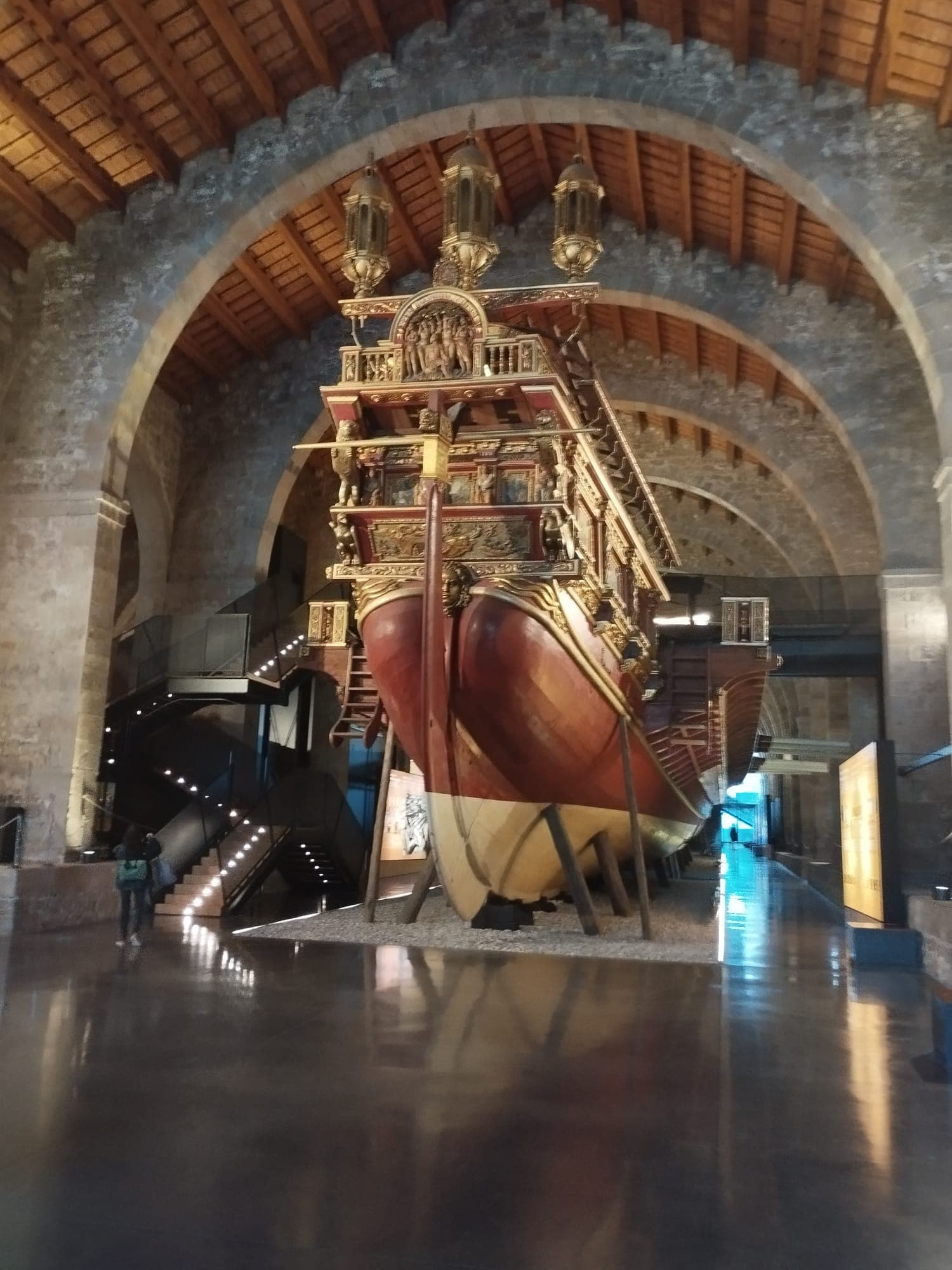 The royal galley replica beneath the stone arches of the medieval Royal Shipyards, home to Barcelona’s Maritime Museum