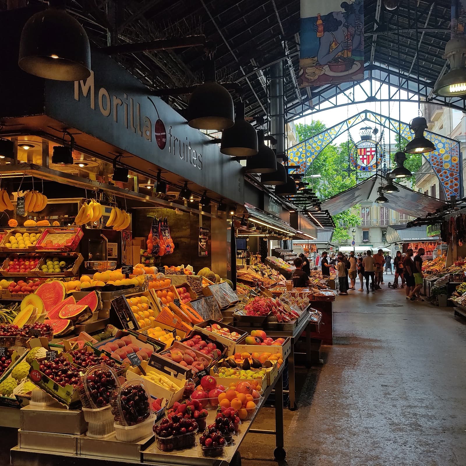 Colourful produce stalls inside the Boqueria market in Barcelona