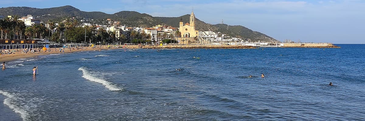 The beach and seafront church of Sant Bartomeu i Santa Tecla in Sitges