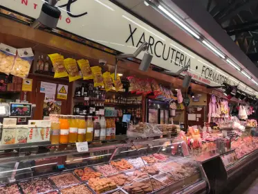 Preserves and sausages ranged along a xarcuteria counter