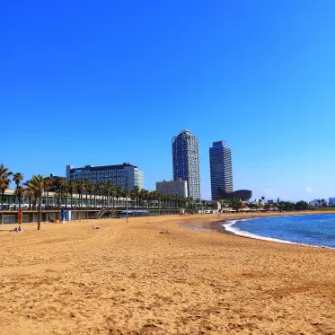 Barceloneta beach with the sail-shaped hotel and the seafront towers