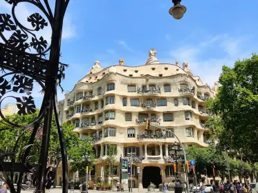 La Pedrera framed by one of the street’s wrought-iron lamps