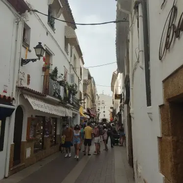 A busy shopping street in the old town behind the seafront