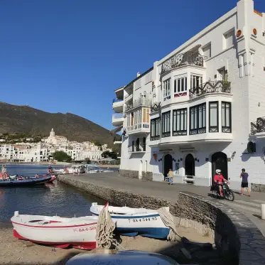 Boats drawn up below the white seafront houses of Cadaqués