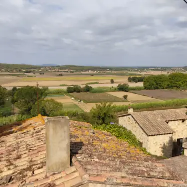 The Empordà plain spread out below the village walls