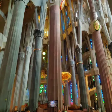 The great columns of the nave with coloured light beyond