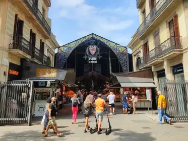 The Modernista stained-glass arch marking La Boqueria’s entrance on La Rambla
