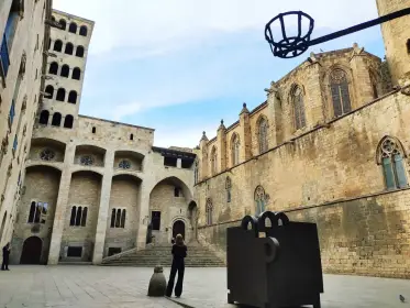The medieval royal palace at Plaça del Rei, with the arches of the Saló del Tinell and the tiered Mirador del Rei Martí