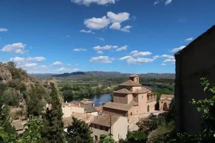 A monastery church standing above the river valley