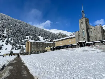 A mountain sanctuary under fresh snow at the head of the valley