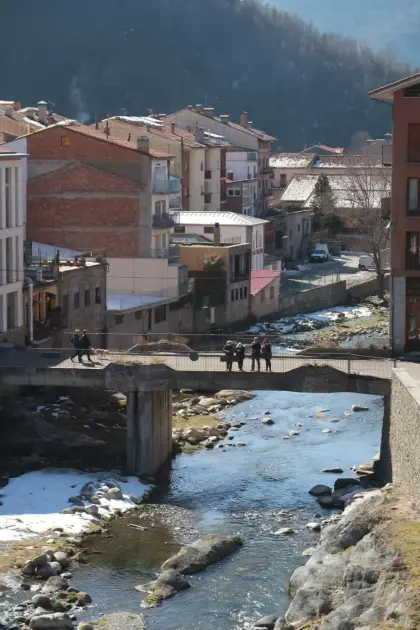 The river running through the village between stone embankments
